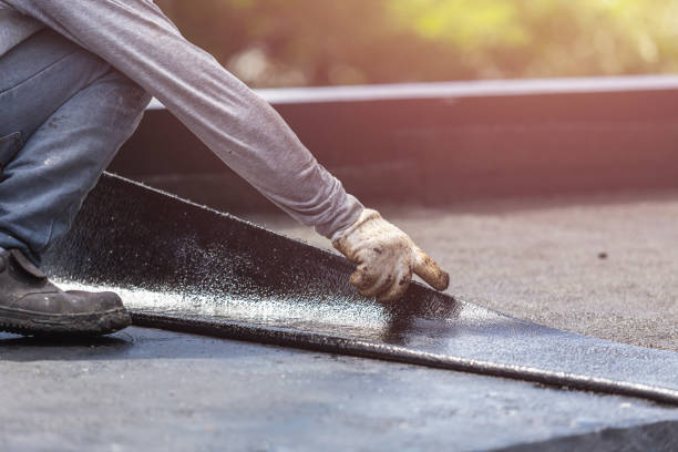 Professional Waterproofing technician working in Howell, MI